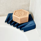 Ripple self-draining corner soap dish for shower and bathroom by Zura Nest in blue